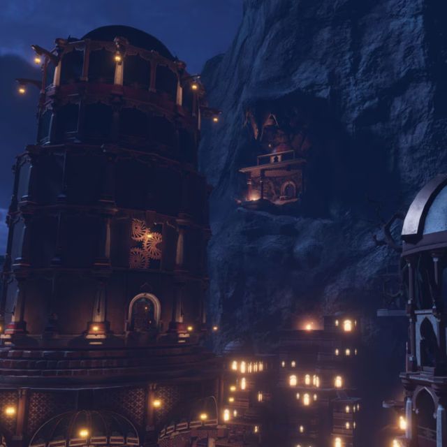 Palais de pierre aux nombreuses fenêtres allumées sous un ciel nocturne bleu, salle Prince of Persia chez Inoui VR