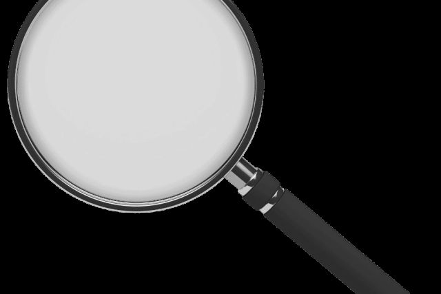Loupe à manche noir sur fond blanc, visuel de Monky à Estillac