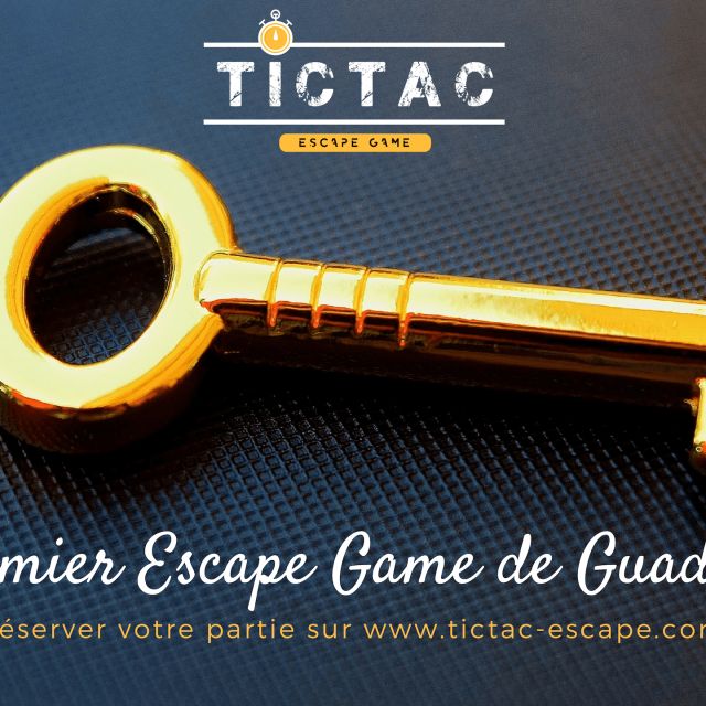 Clé dorée sur fond bleu, Le premier Escape Game de Guadeloupe, enseigne Tictac Escape Game à Baie-Mahault