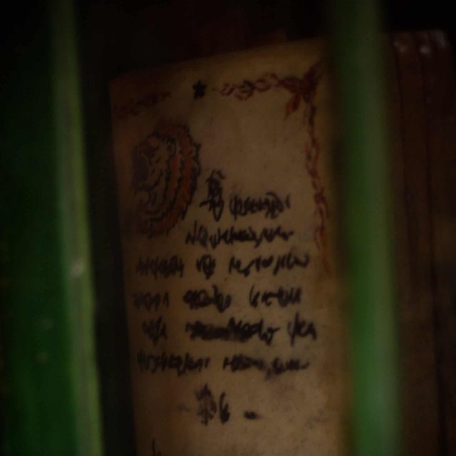 Texte ancien écrit à l'encre sur parchemin tâché, dans Escape the Winkelgasse chez Mastermind à Bern
