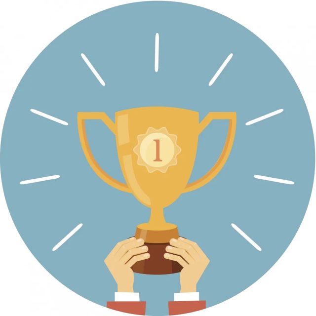 Coupe de champion dorée tenue à deux mains sur fond rond bleu clair, salle Sous-marin Nautilus chez Time Out