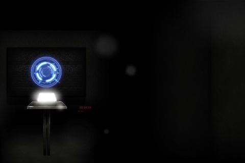 Écran affichant un cercle lumineux bleu futuriste avec compte à rebours en ambiance sombre, chez Lock Out à Antibes