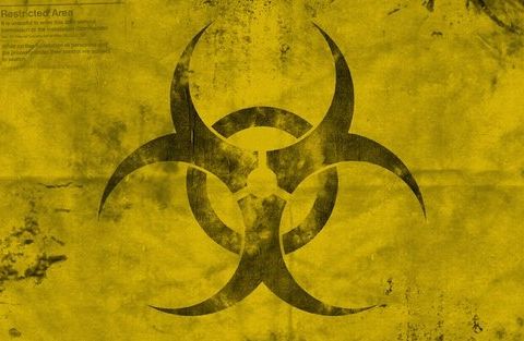 Symbole de biohazard sur fond jaune dégradé, thème viral de la salle Contamination
