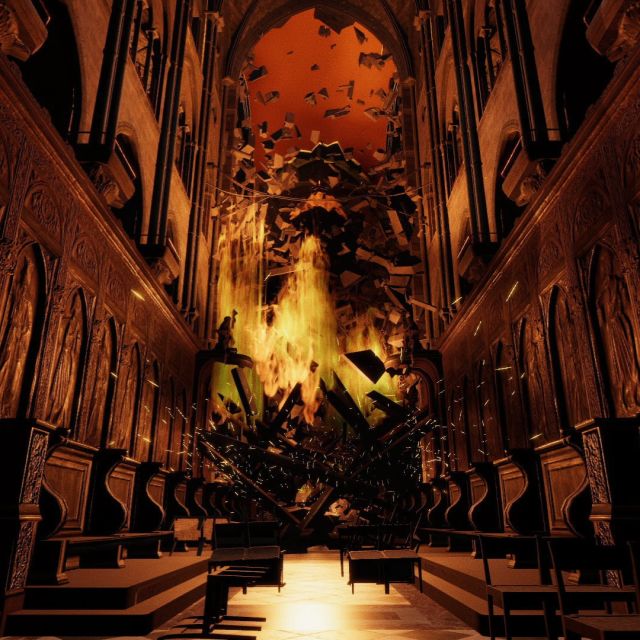 Nef de cathédrale gothique envahie par les flammes au fond, décor virtuel de la salle Sauver Notre-Dame chez Inoui VR