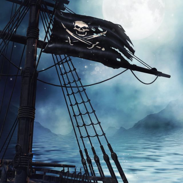 Mât d'un voilier avec drapeau pirate sur une mer brumeuse, salle Le bateau pirate chez Deadline Escape Game au Thor