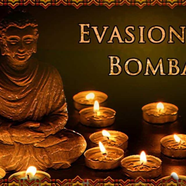 Bouddha doré et bougies allumées dans l'ambiance de la salle Evasion à Bombay